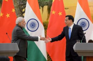 Indian Prime Minister Narendra Modi (L) shakes hands with Chinese Premier Li Keqiang during a news conference at the Great Hall of the People in Beijing, China, May 15, 2015. REUTERS/Kenzaburo Fukuhara/Pool